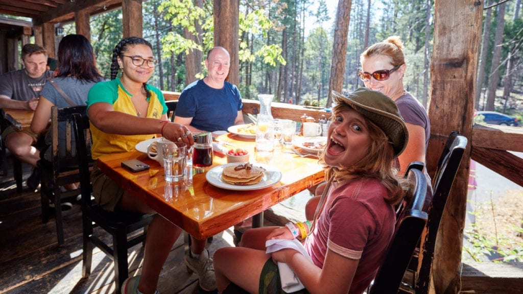 Family eating breakfast at Evergreen Lodge in Yosemite.