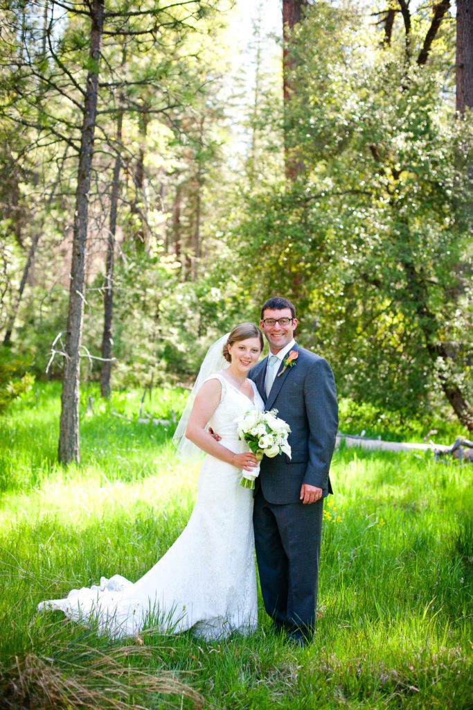 bride and groom in the forest at Yosemite National Park.