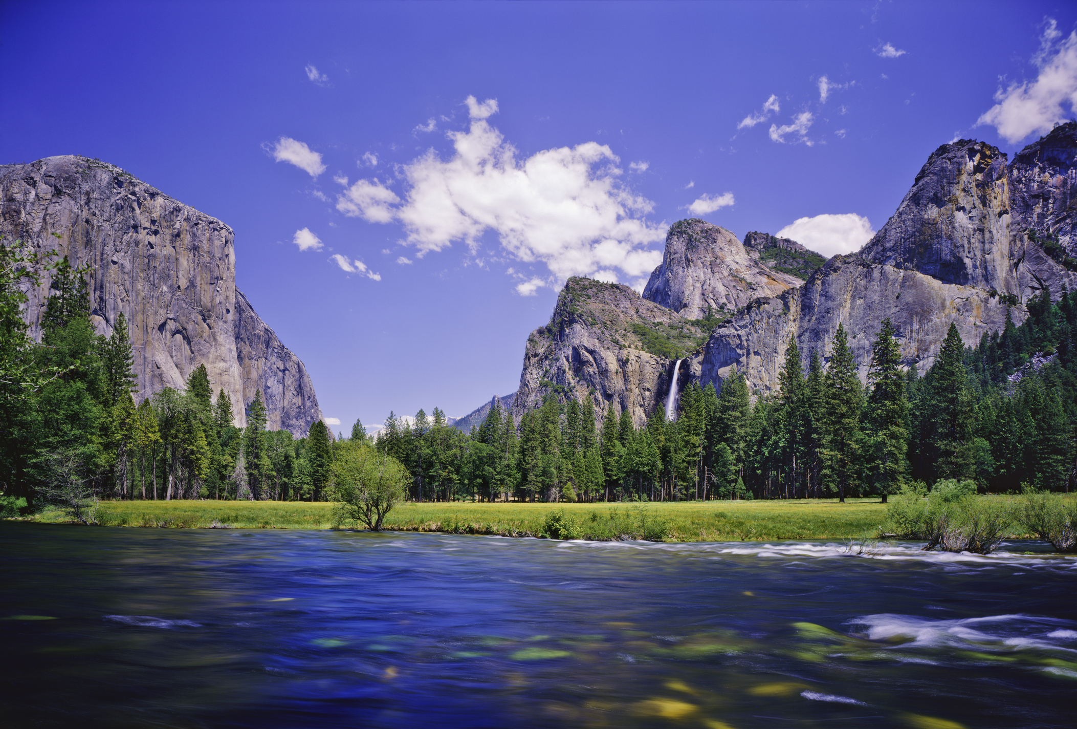 Merced River in Yosemite Valley during summer.